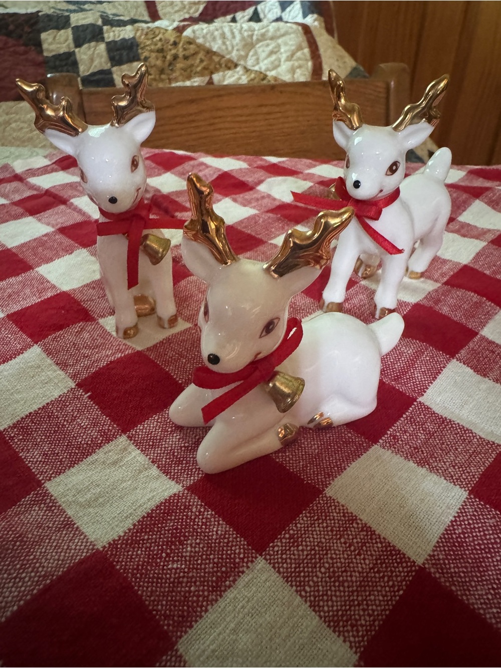 Vintage White Ceramic Reindeer Holiday Figurines with Gold Antlers and Red Ribb